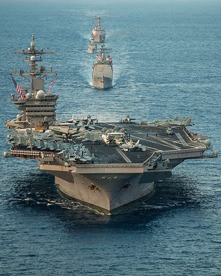 Illustration for article titled Navy Hornets Mock-Dogfight With Malaysian Flankers In South China Sea